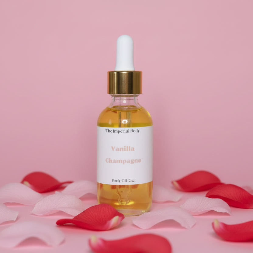 White 2oz dropper oil bottle  'Vanilla Champagne' with pink and red flower petals on a pink background